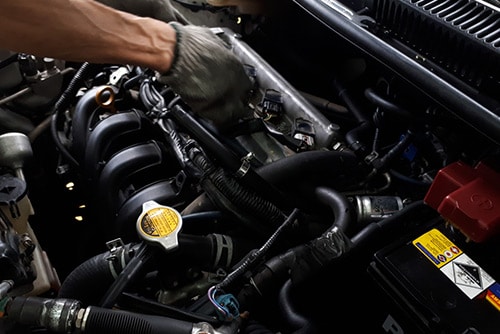 Mechanic Repairing Engine — Automotive & Towing Service in Huskisson, NSW